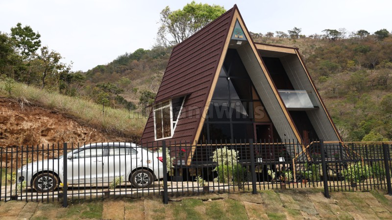 ₹59 Lac&nbsp;|&nbsp;21 cents  agriculture land with wooden house for sale  in kodaikanal